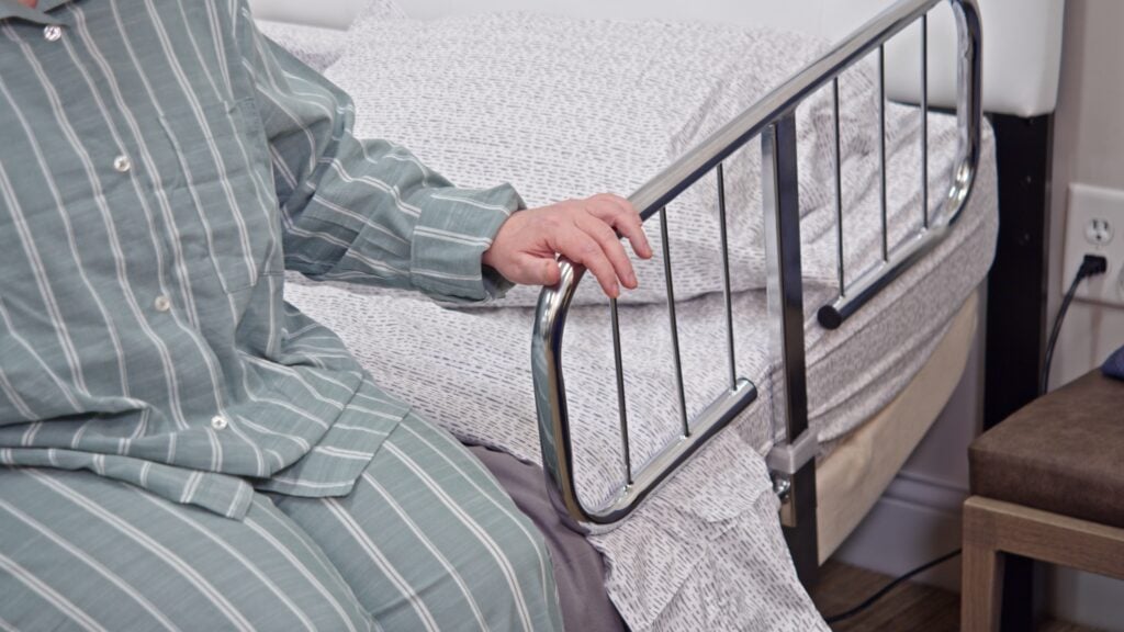 Using the rail to get out of bed