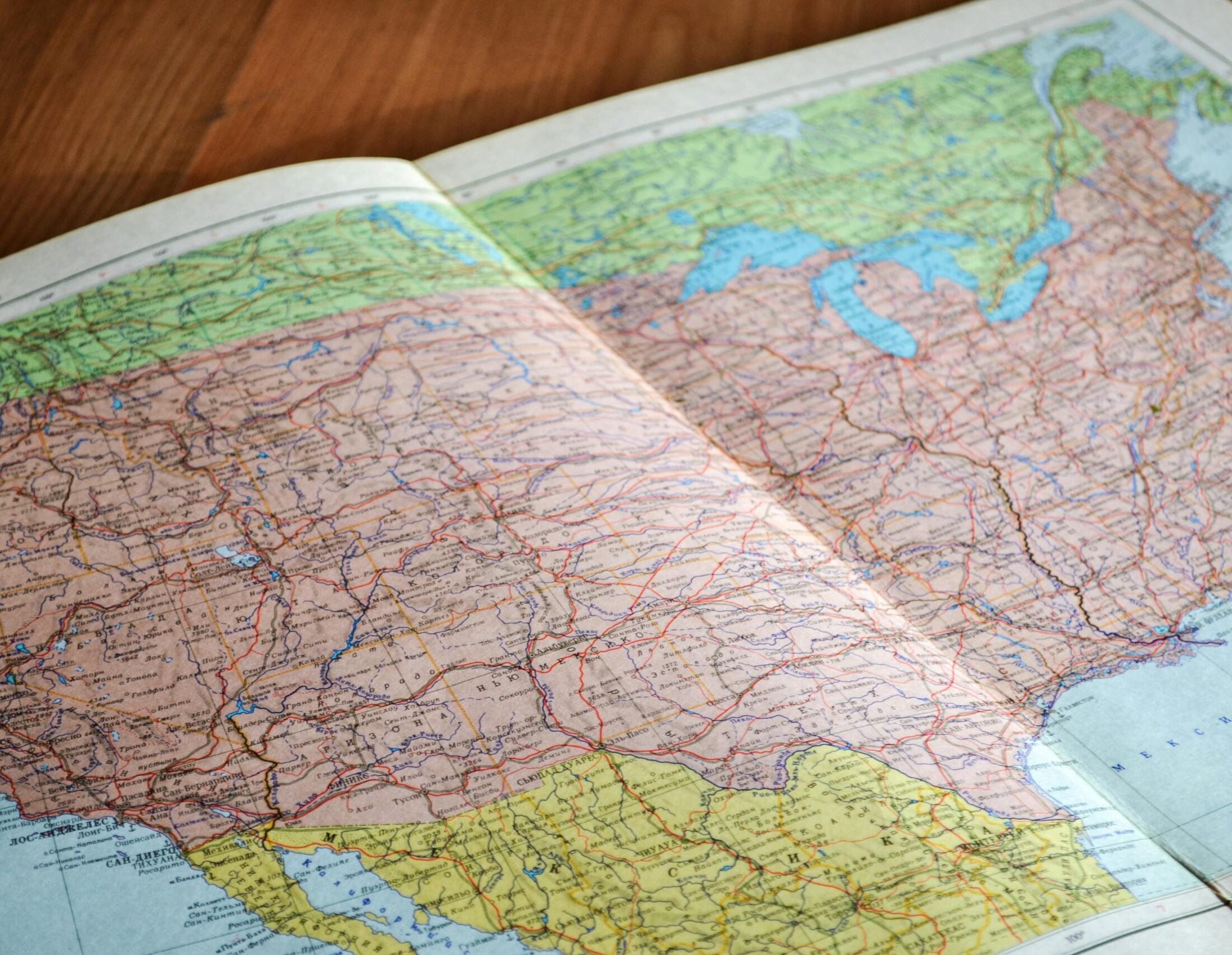 High-angle view of a vintage map depicting the United States with intricate details.